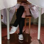 Blonde cutie Ella Nova lifts her flowered skirt up & flashes her muff on a bed