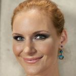 Redheaded MILF Phoenix Marie showcases her sexy round ass and big tits