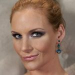 Redheaded MILF Phoenix Marie showcases her sexy round ass and big tits