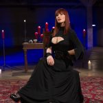 Slutty mistress Madeline Marlowe biting a male sub's cock in hot BDSM action
