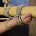 Tied-up Latina Kristina Rose getting clamped while in rope bondage suspension