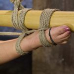 Tied-up Latina Kristina Rose getting clamped while in rope bondage suspension